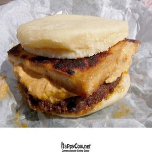 vegan breakfast sandwich: sausage, tofu, and cheese on a fluffy muffin at A Taste of Life in Inglewood