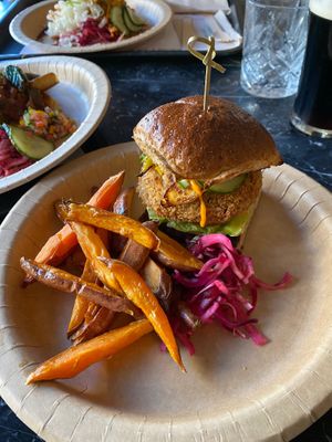 Lentil burger and sweet potato fries.. ate fries before photo!  at Fusca Vegan at The Neighbourhood  in Leamington Spa