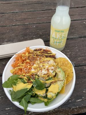 Build Your Own Bowl - Rice, Quinoa, Burrito Bean Mix, Carrot, Spinach, Avocado, Corn Chips, Coconut Yogurt, Nacho Cheese Sauce, Crispy Onions & Sesame Seeds.  at Bowl Me Over in Brighton