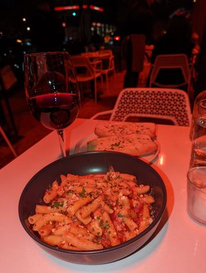 Rigatoni Arrabiata & garlic bread paired w/ Chianti Classico. 🍝🍷 at Sestina in New York City