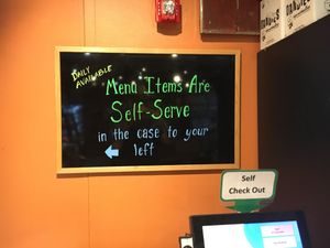 Board inside at Natures Green Grocer Cafe in Peterborough