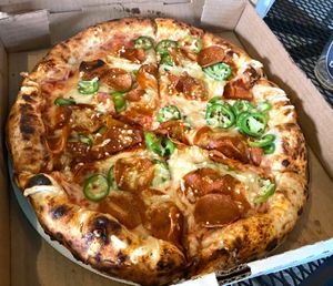 Build you own custom pizza with vegan pepperoni and jalapeños.  at Ozone's Brewhouse in Lansing