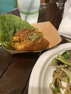 Potato Croquettes (one bite in)  at Peace Cafe in Honolulu