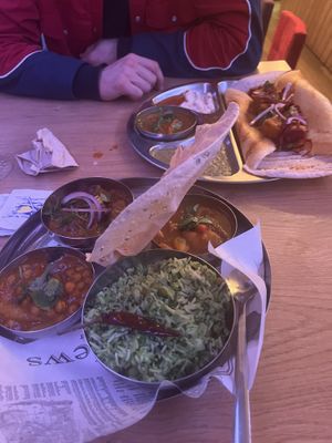 Vegan curry option with the chana, sambar, and eggplant options and a dosa potato masala.   at Ganesh in Brussels