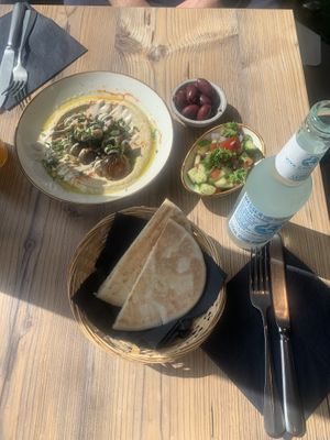 Hummus with champignons, olives and side salad  at Iss Was - Fusionsküche in Giessen