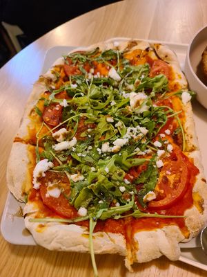 Pinsa with feta and tomatoes at Tolstoy in Vienna