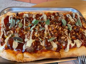 Barbecue meatballs, roastes almonds and barbecue sauce flatbread  at Tolstoy in Vienna
