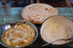 “No chicken” Korma (medium), vegan cheese naan, pilau basmati ricee  at Cinnamon in Sitges