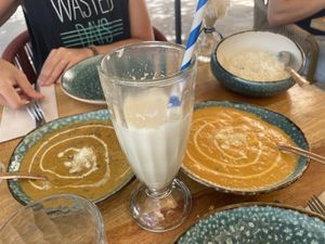 Pistacho rosa lassi + curries  at Cinnamon in Sitges