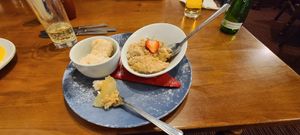 Vegan apple and cinnamon crumble. Dense and crumbly, very hot. Ice-cream with vanilla and caramel tones. Real slices of apple. No overt cinnamon taste. at The Springhill in Wolverhampton