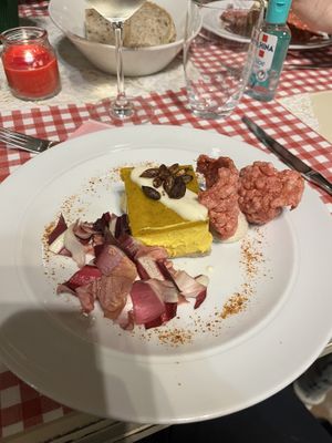 Cheesecake salata alla zucca, mandorle e zafferano, con salsa affumicata alla paprika, semi di zucca tostati e speziati al limone e pepe rosa.  at Agriturismo Biologico La Buona Terra in Cervarese Santa Croce