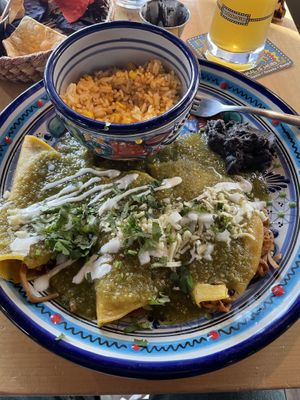 Enchiladas w/ rice and a side of refried beans   at Mexhico Restaurant in Barrie