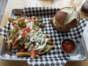 Stuffed burger with loaded fries   at Mexhico Restaurant in Barrie