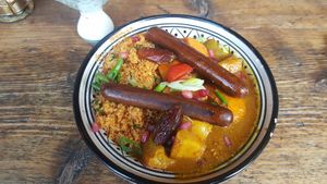 Gemüse Tajine mit zwei veganen Würstchen at Bei Frau Nanna in Frankfurt