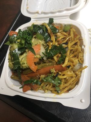 Noodles, sting beans, vegetables, and kale salad   at Four Seasons Cafe & Juice Bar in Brooklyn