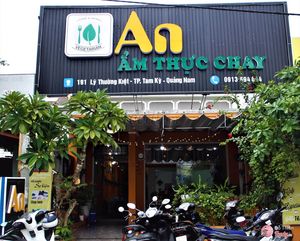 front of the restaurant with prominent sign to look for. at An Am Thuc Chay in Tam Ky