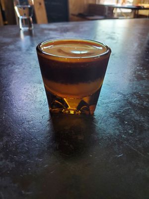 This is an undertow! Vanilla syrup, milk of choice, and a shot of espresso on top. at Spokesman in Austin