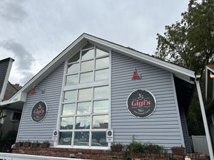 Cute blue house w parking right in front   at Gigi's Vegan + Wellness Cafe in Kansas City