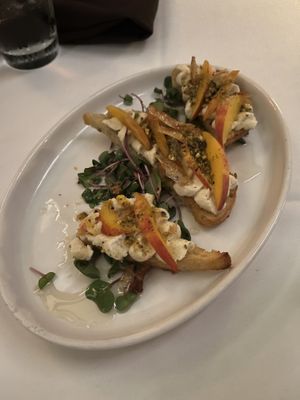 Peach toast with ricotta, pistachio, and rice paper bacon. Can’t taste the bacon at all   at Kres Chophouse in Orlando