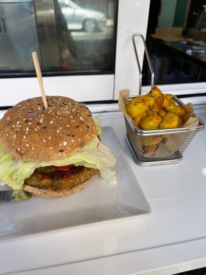 Lentil and Brown Rice Burger with fries. at Kinoa in Malaga