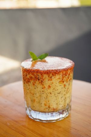 Our famouse "Pura Vida!", this delicious Maracuyá-mezcal cocktail and a chilli powder dash! at Version Vegana in San Andres Cholula