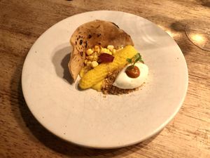 Old Corn, New Corn (pattern detailed onto corn meal)  at Charred Kitchen & Bar in Orange