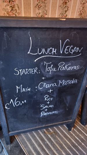 Street sign at Garlic n Greens in Bruges