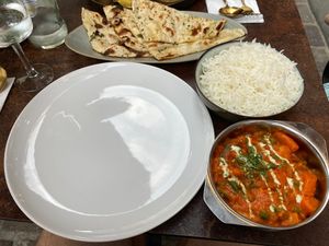 Vegetable tikka masala and garlic naan  at Garlic n Greens in Bruges