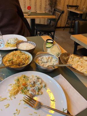 Korma, garlic naan, rice, onion saladd  at Garlic n Greens in Bruges