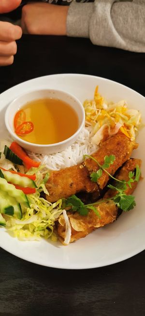 Noodles, vegetables, spring rolls at Linh - Not Just A Restaurant in Prague