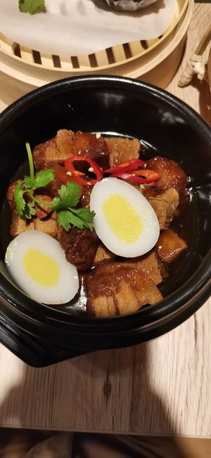 Grandma's clay pot with "pork belly," "eggs", rice and salad at Linh - Not Just A Restaurant in Prague