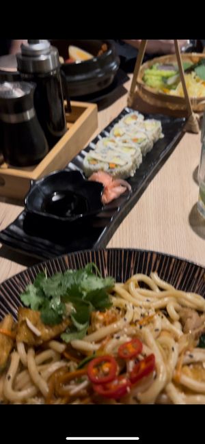 Vegan Udon Noodles, Sushi and in de background the claypot with vegan pork belly at Linh - Not Just A Restaurant in Prague