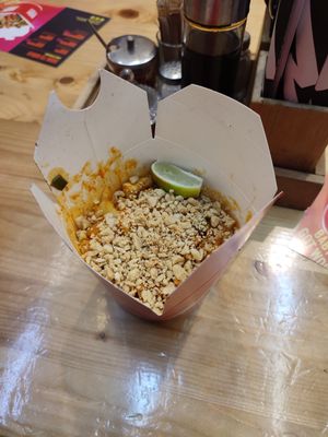 Rice noodles, sweet and sour sauce with tofu and peanuts at Wok To Walk - Damstraat in Amsterdam