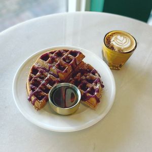 Banana Bread Waffle with Berry Coulis & maple syrup. at Cyth & Co in Oakland Park