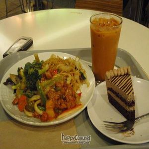 Mocha cake, thai iced tea, chow mein, sweet and sour fake chicken, garlic veggies. at Loving Hut - Westfield Mall Food Emporium in San Francisco