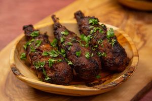 Jerk “Chicken” Wings on a succulent, sweet sugar cane bone at Jam Delish in North London