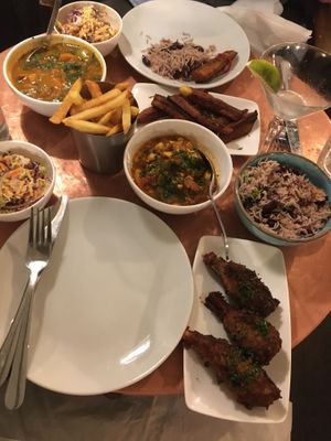 Chicken curry, rice and peas, fries, plantain fries, ackee and codfish, mix n match wings  at Jam Delish in North London