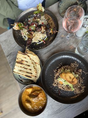 Chicken skewers, roti and goat curry   at Jam Delish in North London