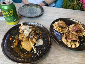 ‘Prawns’ with bammy (cassava bread) on the left, ‘pork belly’ tacos on the right    at Jam Delish in North London