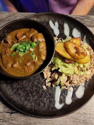 Goat curry, rice and plantain at Jam Delish in North London