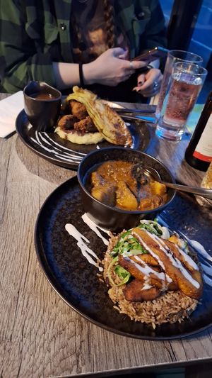 Fried chicken and goat curry at Jam Delish in North London