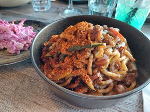 carribean slaw ($6.50) & "Oxtail" Chow Mein: jackfruit & mushroom stew with udon noodles ($18) at Jam Delish in North London