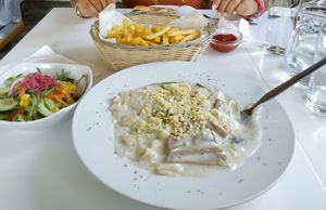 Tagliatelle with mushrooms + french fries and salad !  at Loving Hut in St Kanzian