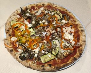 Their vegetarian Pizza but the mozzarella is replaced with their vegan mozzarella, very good at Al Ventitre in Lazise