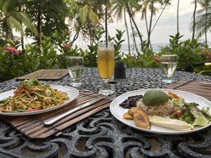 Left: Asian noodle dish, mildly spicy with coconut milk and ginger. Right: Casado con vegetales.  at Ylang Ylang Beach Resort Restaurant in Montezuma