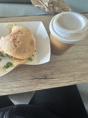 Very small coffee next to the tiny vegan burgerr  at Frocals Kings Beach in Caloundra