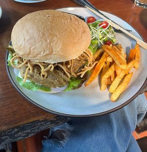 The signature Pan Kled burger (Khao Soi burger) is a must. It’s a little bit spicy but amazing   at Shann Cafe  in Chiang Rai