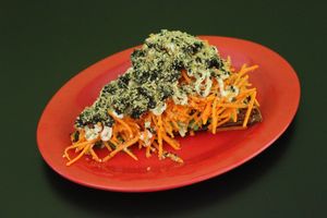 Raw Vegan Pizza Slice topped with black olives if you choose.  at Rawk Star Cafe and Marketplace in Oldsmar