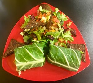 The Rawkster Wrap with an added Salad! Mediterranean style nut pate (made with pumpkin seeds, pecans, bell pepper, apples and spices) in a collard wrap with veggies! at Rawk Star Cafe and Marketplace in Oldsmar
