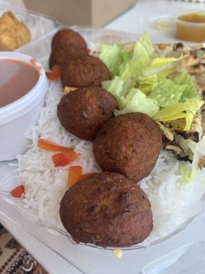 Veggie meatballs with rice, garlic naan and masala sauce.    at Greenhaus Eatery in San Diego